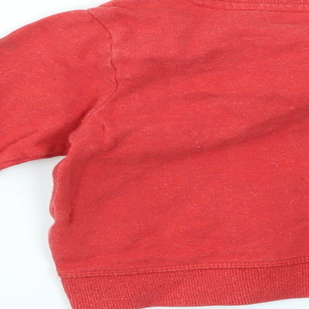 Brand and care label for M boys’ red jumper, size 12-18, months