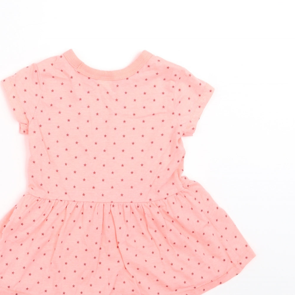 Brand and care label for Next girls’ orange geometric t-shirt dress, size 6-9, months - star pattern