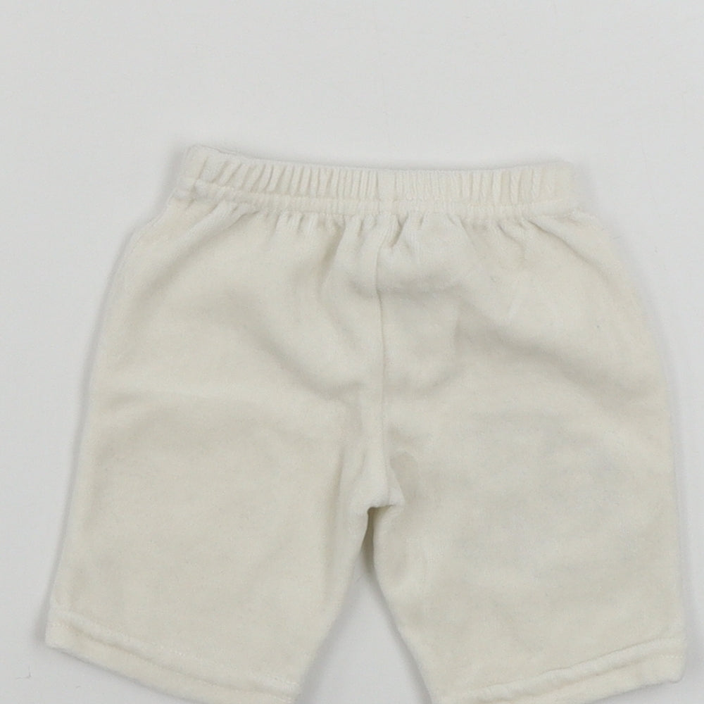 Brand and care label for Zip Zap girls’ beige sweatpants size newborn