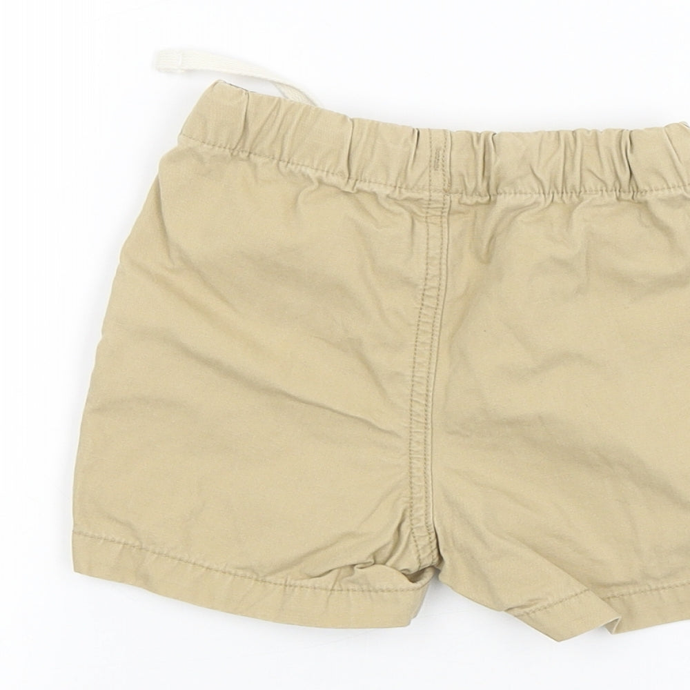 Brand and care label for Gap Baby Brown Cropped Jeans, size 12-18, Months