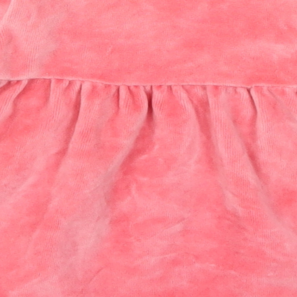 Brand and care label for M&Co girls’ pink skater dress, size 9-12, months