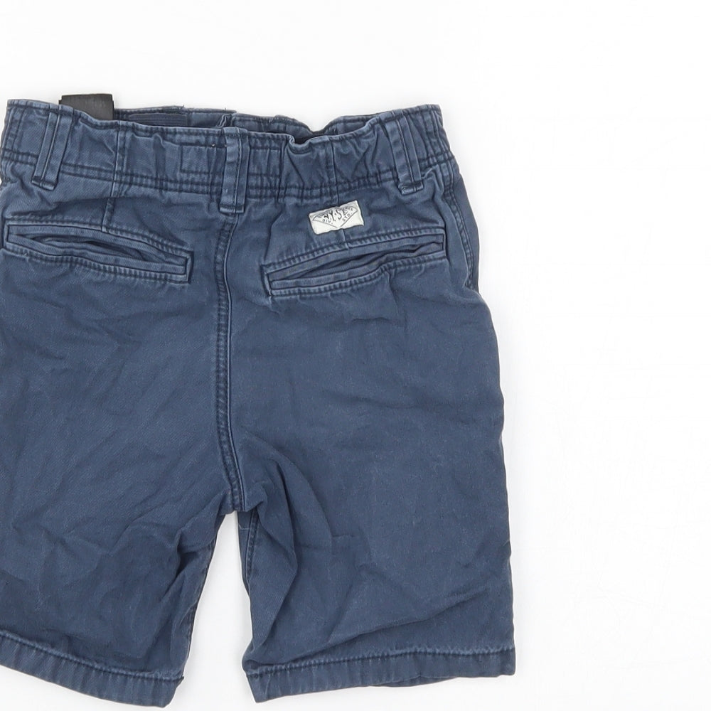Brand and care label for LOGG boys’ blue denim chino shorts, size 5-6, years