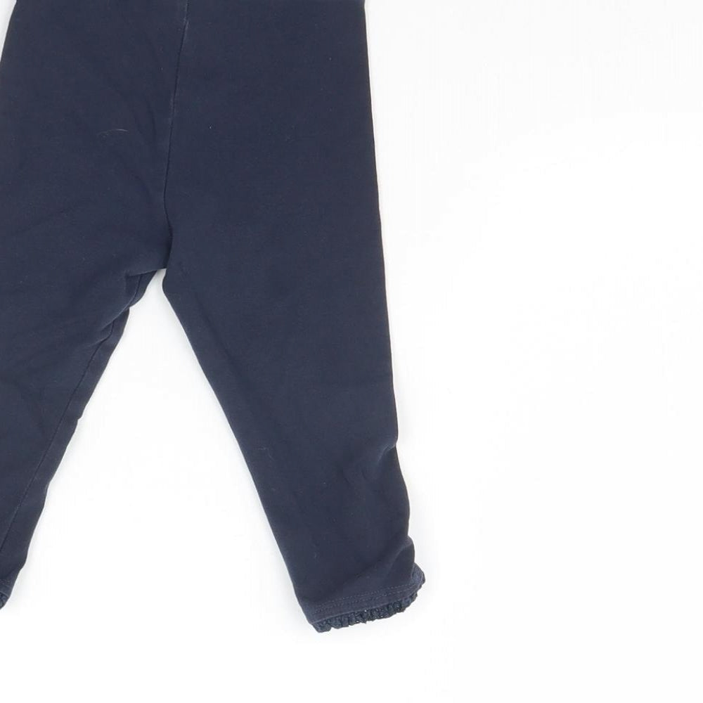 Brand and care label for Next Baby Blue Capri Trousers, size 9, Months