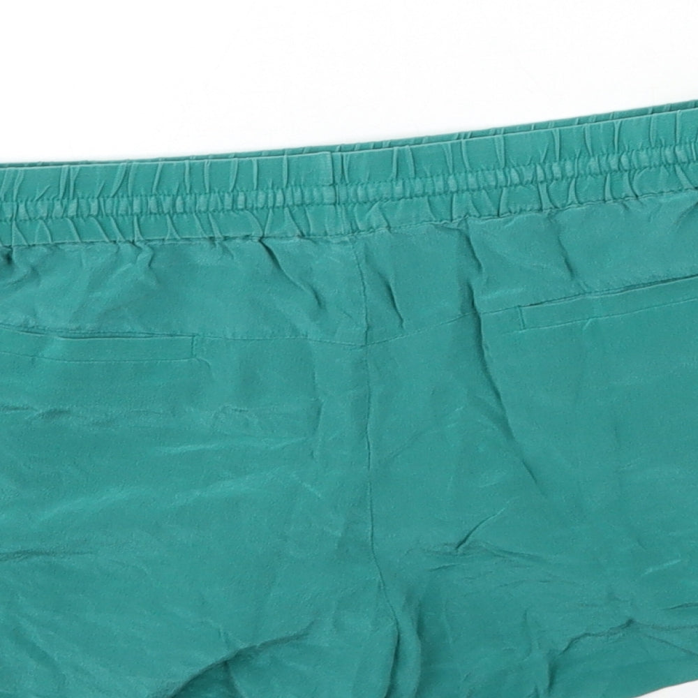 Brand and care label for French Connection women’s green hot pants shorts, size UK 6