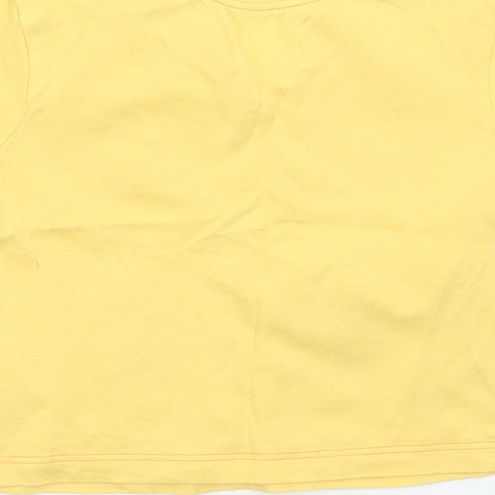 Brand and care label for Cherokee boys’ yellow basic t-shirt, size 0-3, months