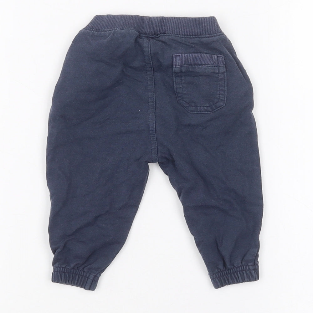 Brand and care label for Mothercare Baby Blue sweatpants, size 3-6, Months