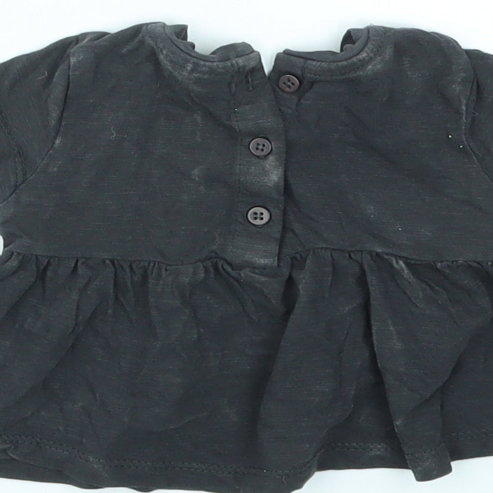 Brand and care label for Next girls’ black basic t-shirt size newborn