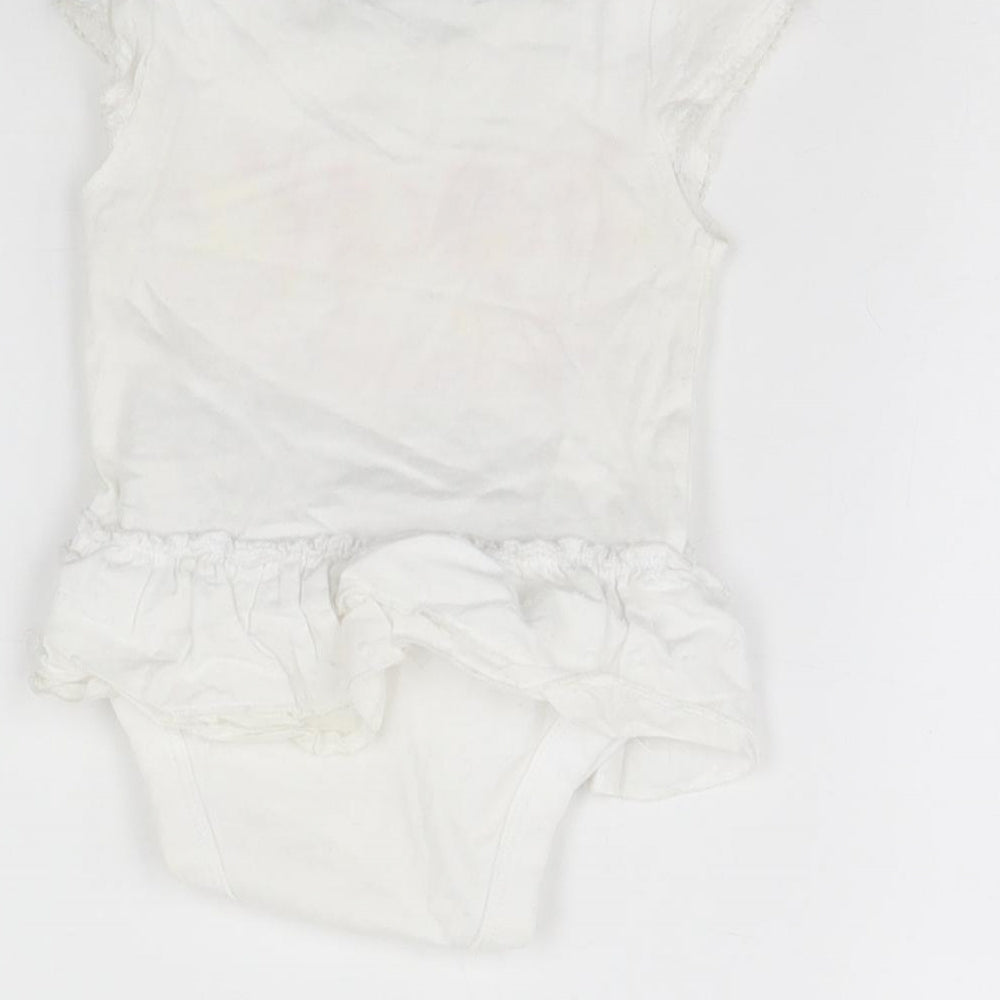Brand and care label for Rocha Little Rocha girls’ white babygrow one-piece, size 0-3, months