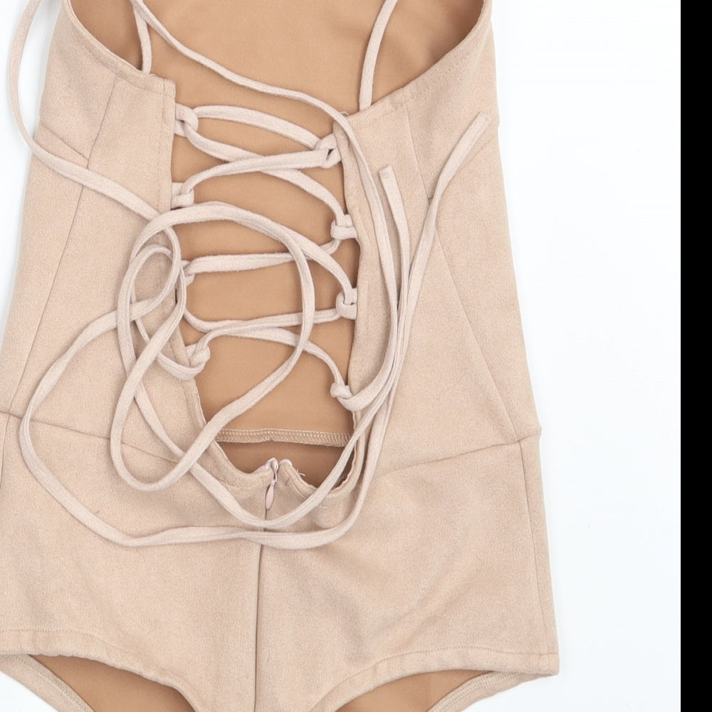 Brand and care label for In the Style women’s pink velvet bodysuit one-piece, size UK 10