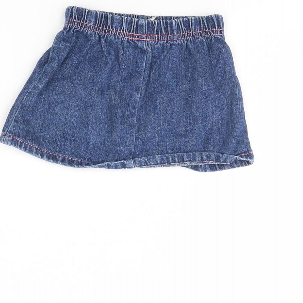 Brand and care label for Tiny Ted girls’ blue denim mini skirt, size 3-6, months