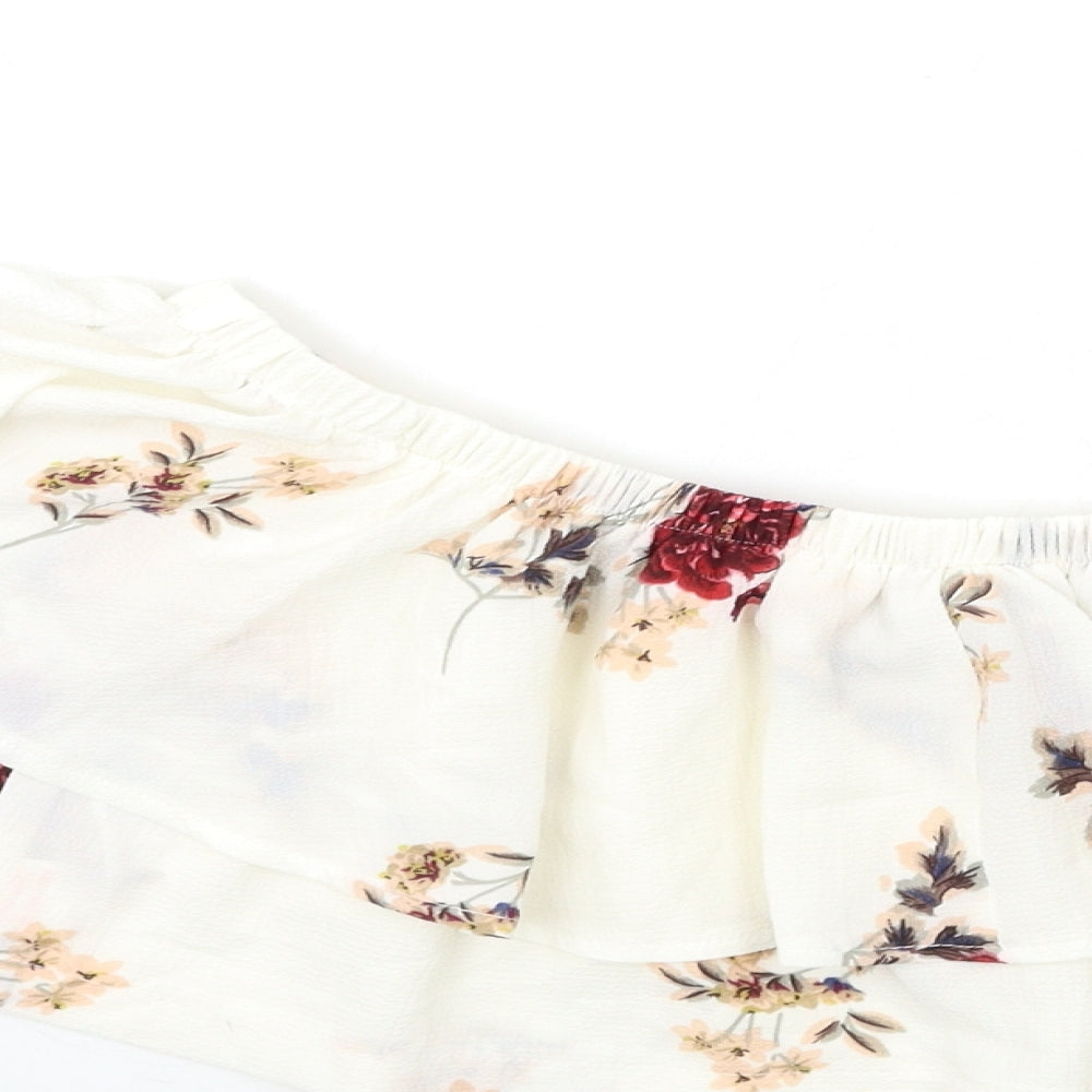 Brand and care label for In the Style women’s white floral basic blouse, size UK 8