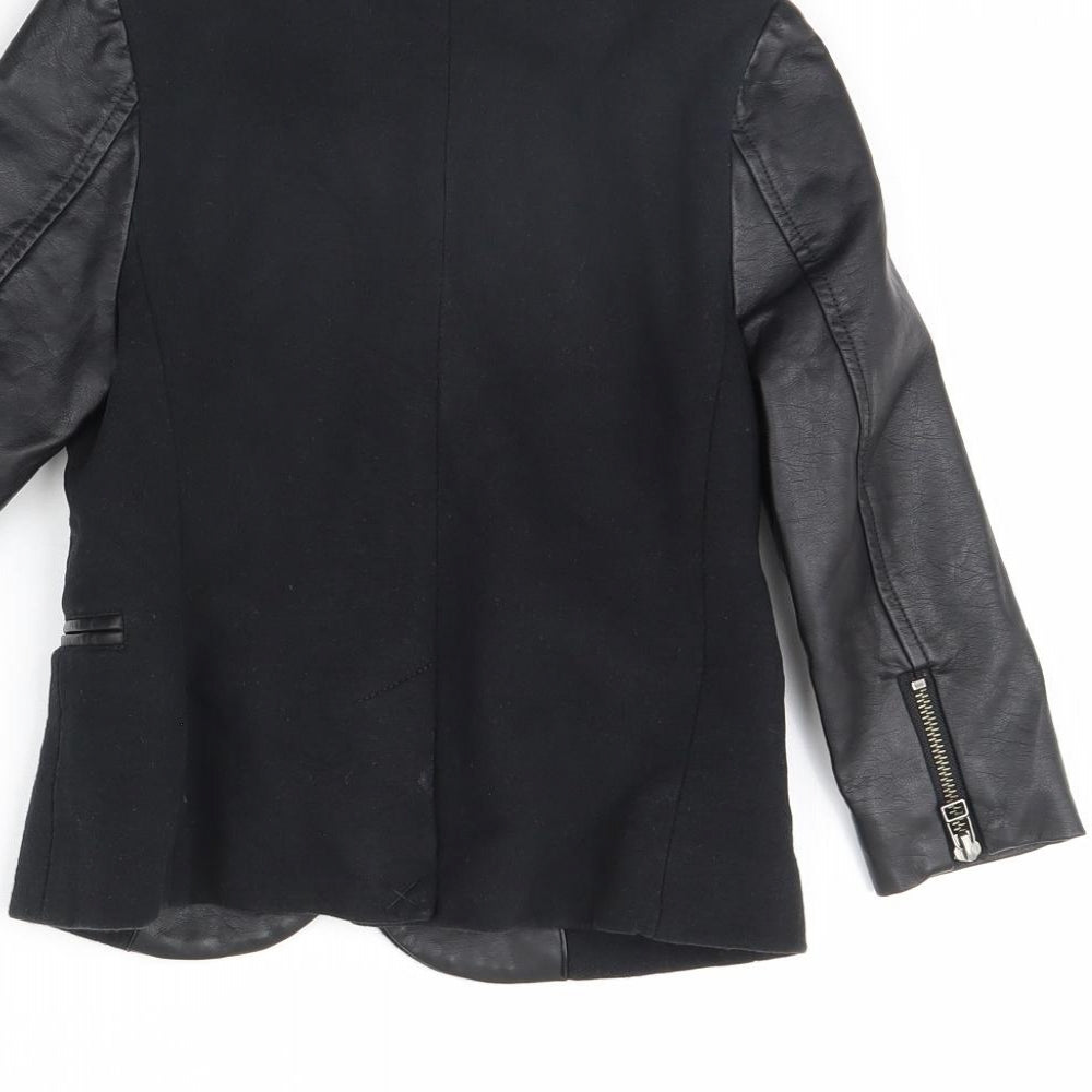 Brand and care label for Next girls’ black jacket, size 5, years