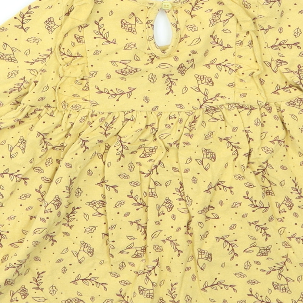 Brand and care label for SO CUTE girls’ yellow animal print fit & flare, size 9-12, months
