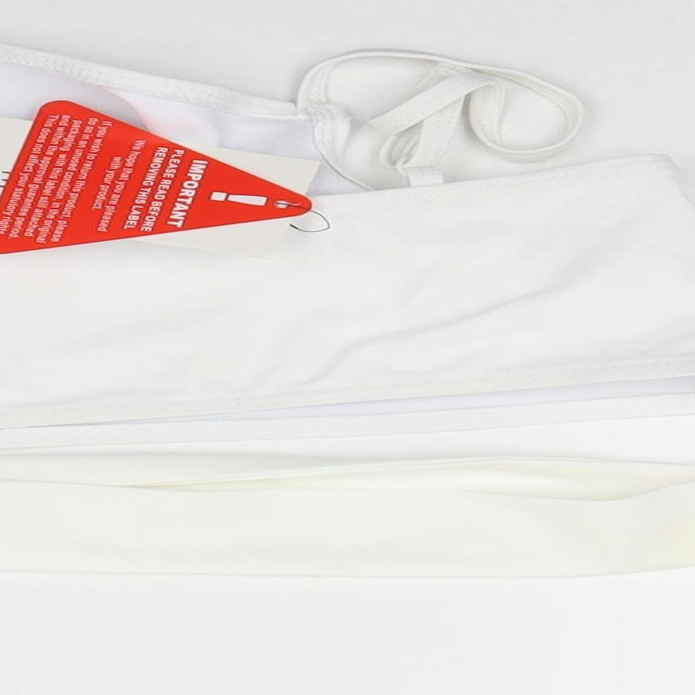 Brand and care label for In the Style women’s white cropped tank, size UK 14