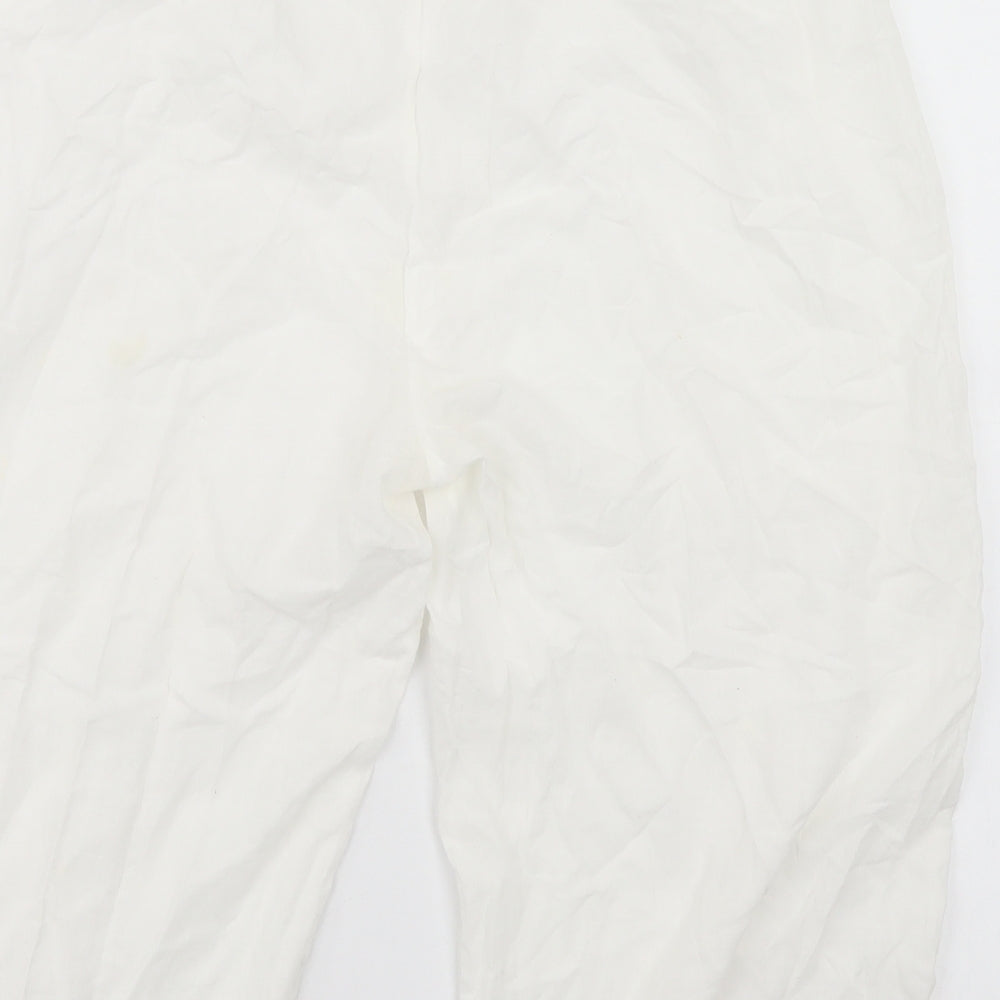 Brand and care label for Preworn women’s white trousers, size M