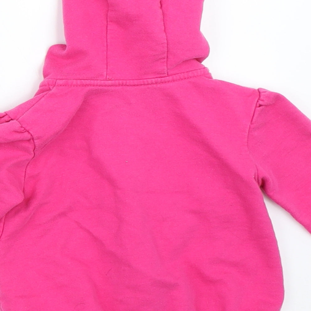 Brand and care label for Disney girls’ pink jacket, size 9-12, months - minnie mouse