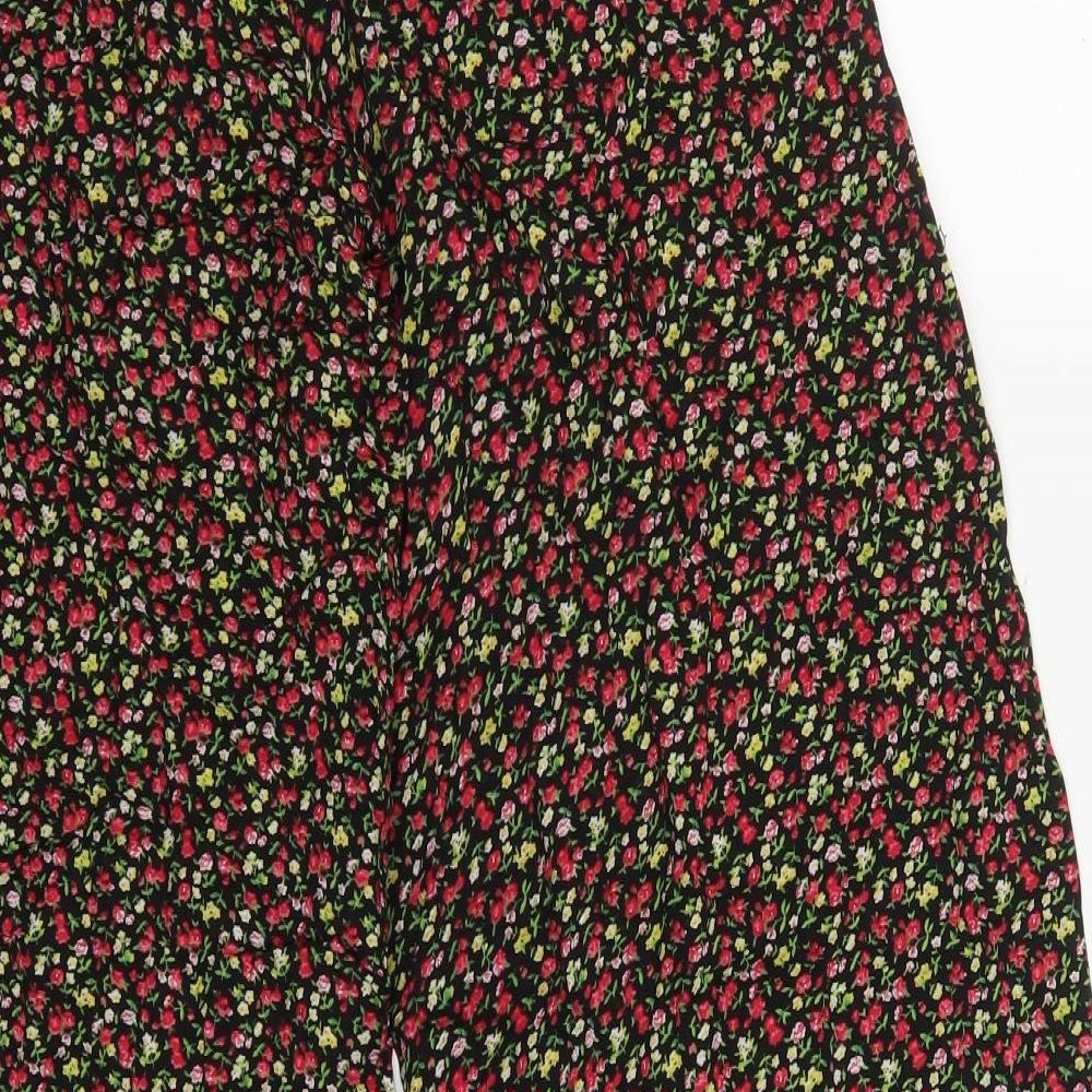 Brand and care label for New York Laundry women’s red floral viscose trousers, size UK 8 regular button - yellow flowers