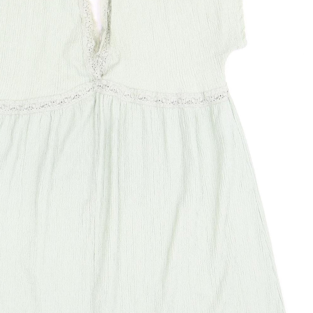 Brand and care label for ASOS women’s green polyester shift, size UK 16, v-neck pullover - lace trim