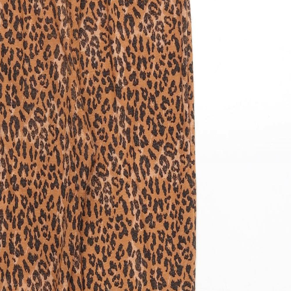 Brand and care label for ASOS women’s orange animal print polyester trousers, size UK 10, regular - leopard print