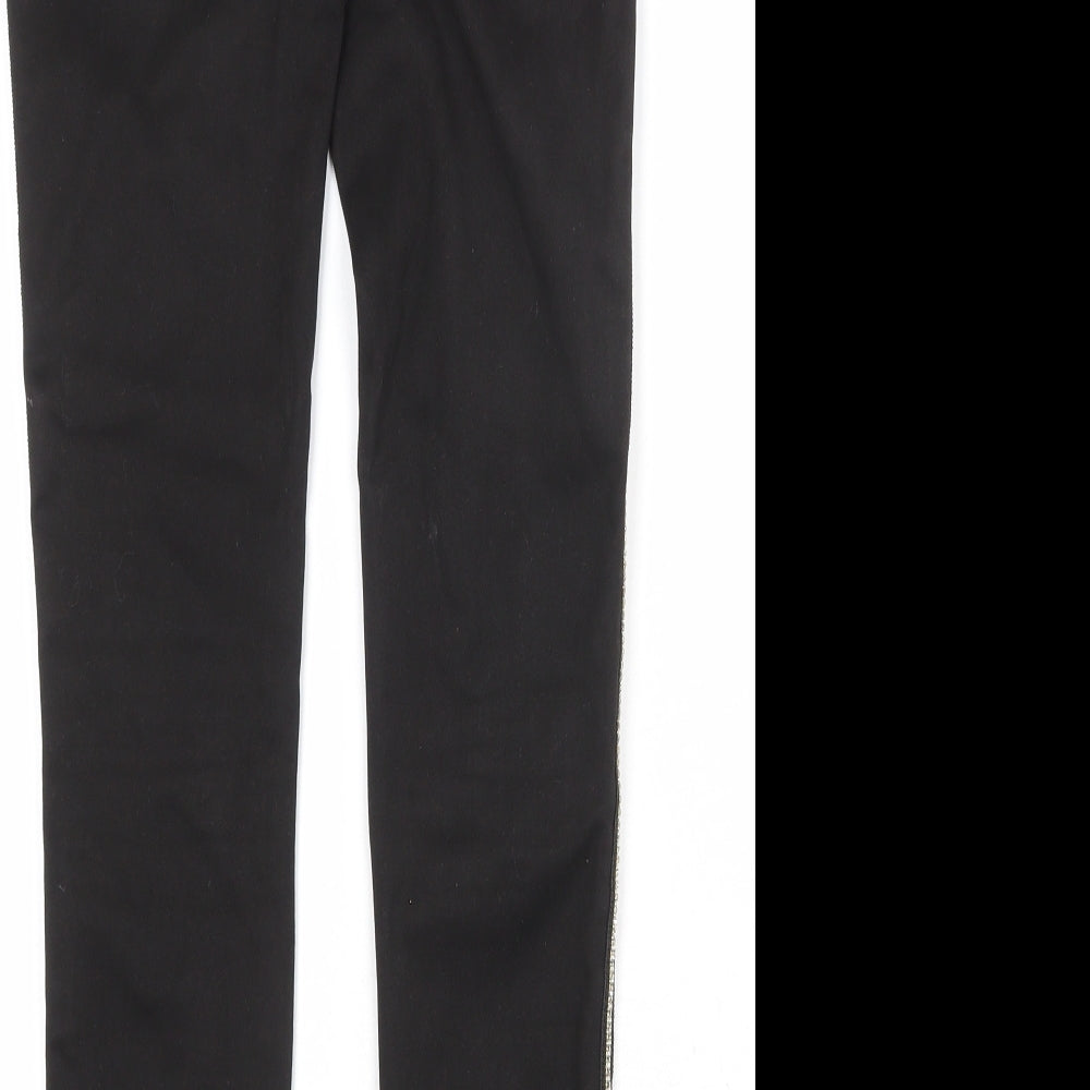 Brand and care label for Toxik3 women’s black cotton skinny jeans, size S, regular zip
