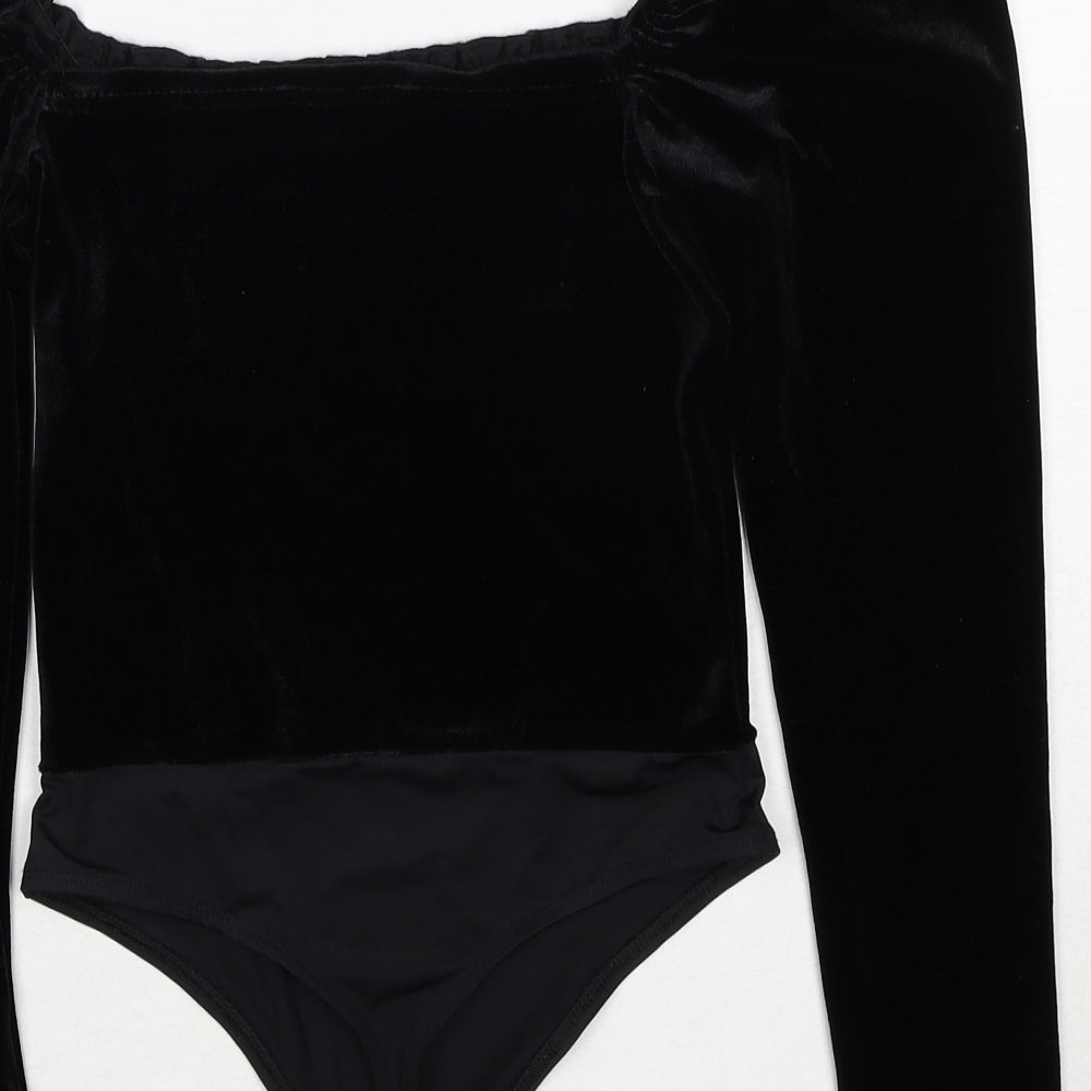 Brand and care label for Miss Selfridge women’s black polyester bodysuit one-piece, size UK 8, snap