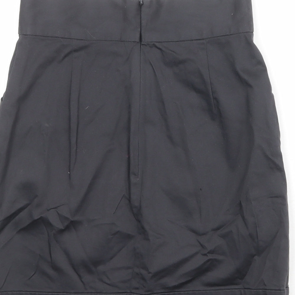 Brand and care label for French Connection women’s black cotton a-line skirt, size UK 6, zip