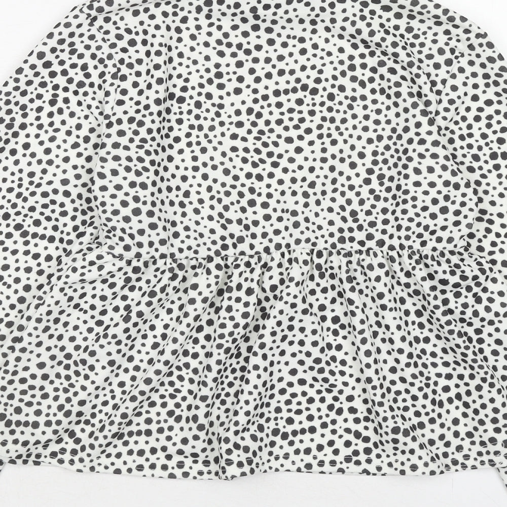 Brand and care label for I SAW IT FIRST women’s white animal print polyester basic blouse, high neck - dalmatian print