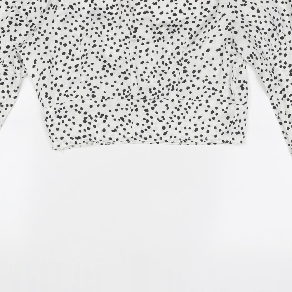 Brand and care label for Missguided women’s white animal print polyester cropped blouse, size UK 8, scoop neck - spotted