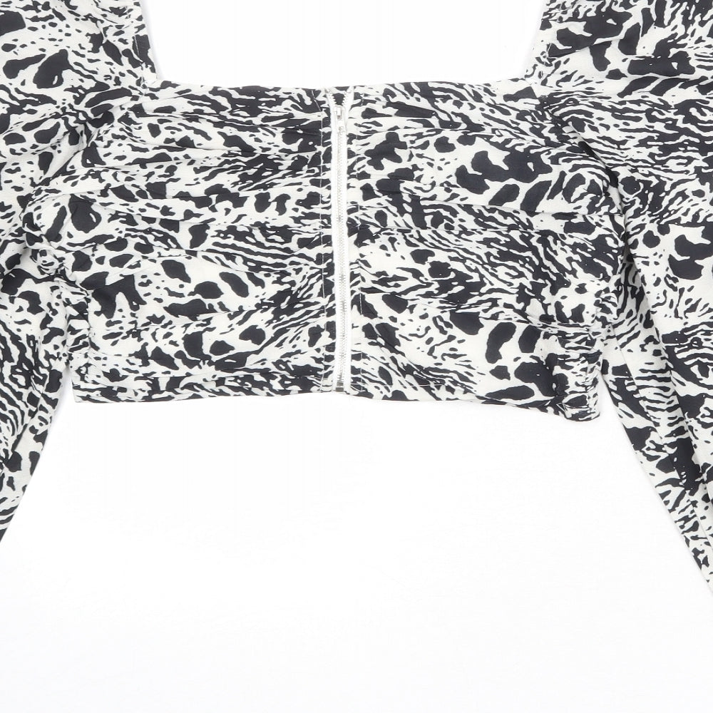 Brand and care label for In the Style women’s ivory animal print polyester cropped blouse, size UK 10, square neck