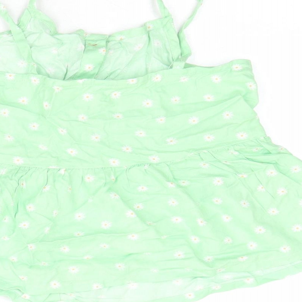Brand and care label for H&M girls’ green floral polyester camisole tank, size 8-9, years square neck button