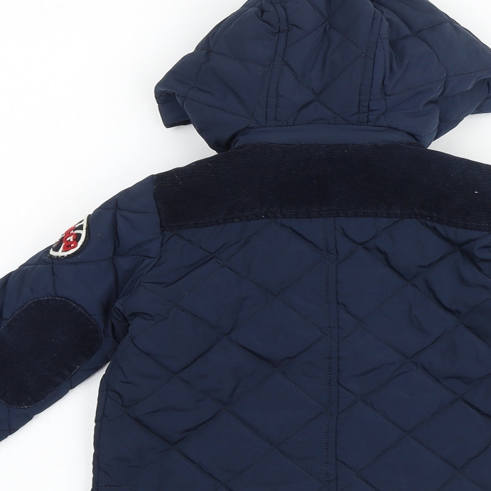 Brand and care label for Freestyle boys’ blue jacket, size 2, years zip