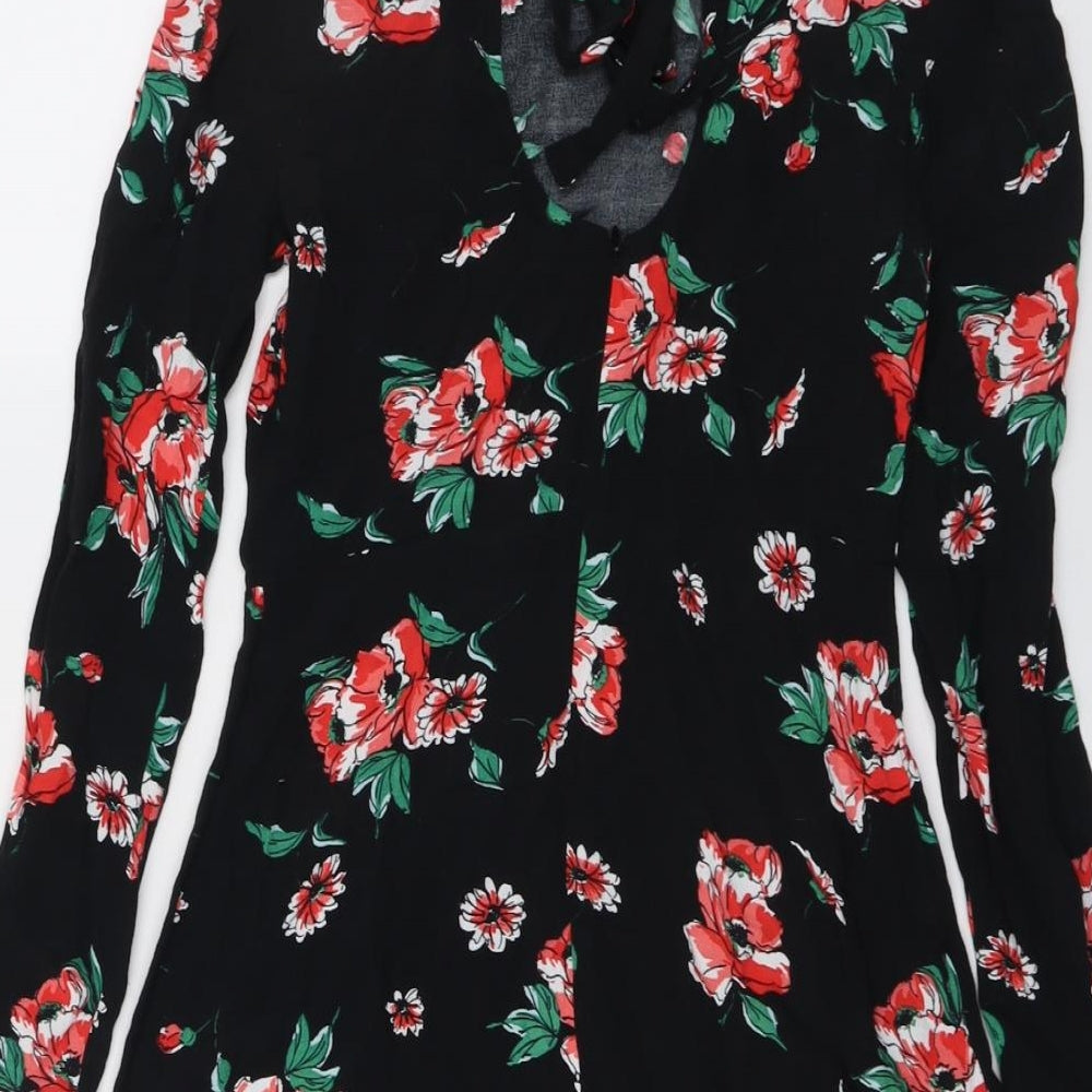 Brand and care label for ASOS women’s black floral viscose a-line, size UK 8, round neck zip