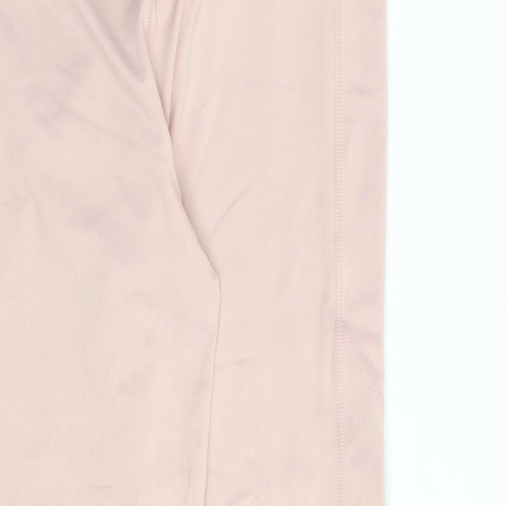 Brand and care label for Ellesse women’s pink polyester compression leggings, size UK 12, regular