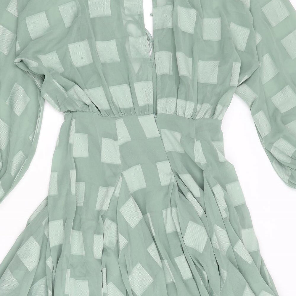 Brand and care label for ASOS women’s green check polyester fit & flare, size UK 4, v-neck zip