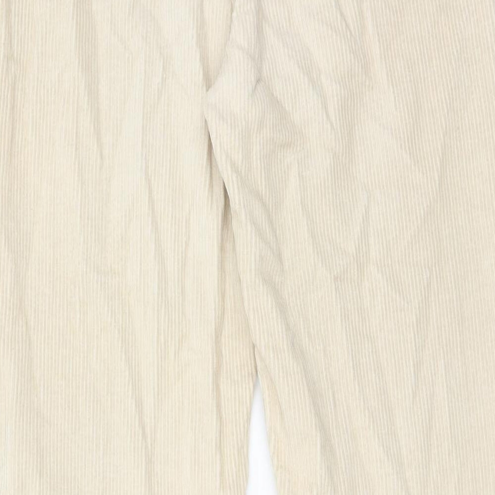 Brand and care label for Denim & Co. women’s beige cotton trousers, size UK 10, regular zip