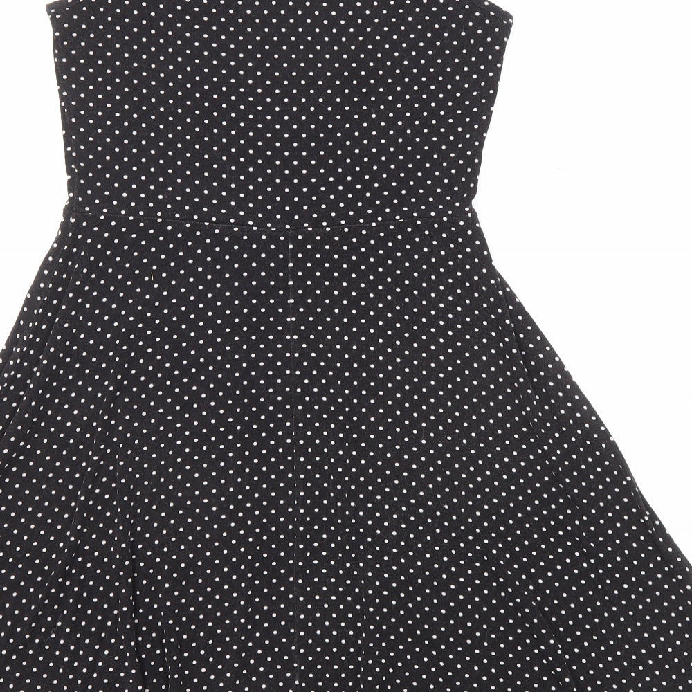 Brand and care label for Miss Selfridge women’s black polka dot viscose fit & flare, size UK 8, boat neck pullover