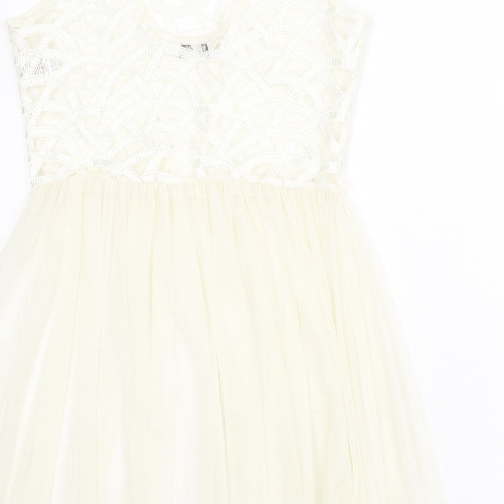Brand and care label for Miss Selfridge women’s ivory geometric polyester fit & flare, size UK 6, round neck