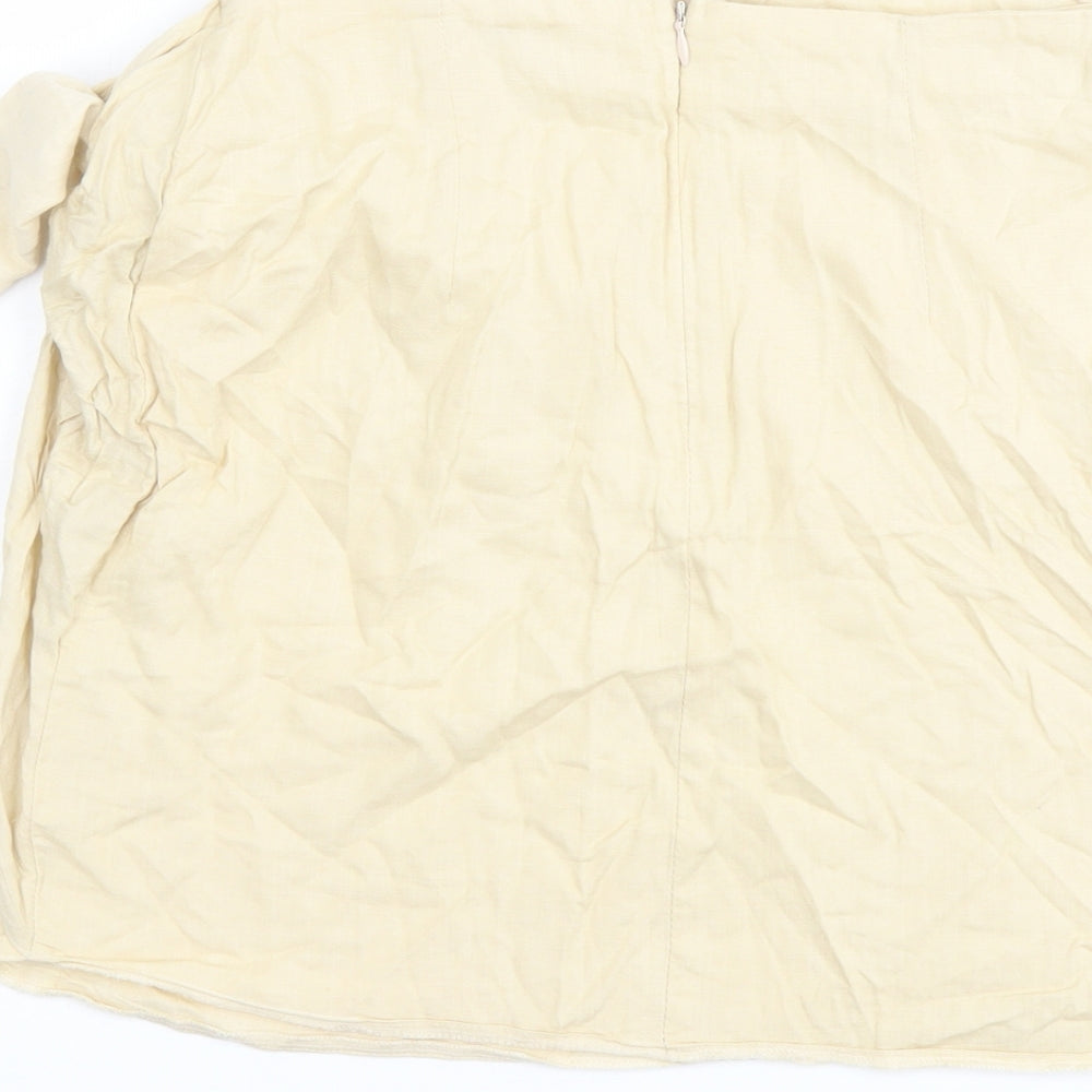 Brand and care label for ASOS women’s beige viscose mini skirt, size UK 8, zip