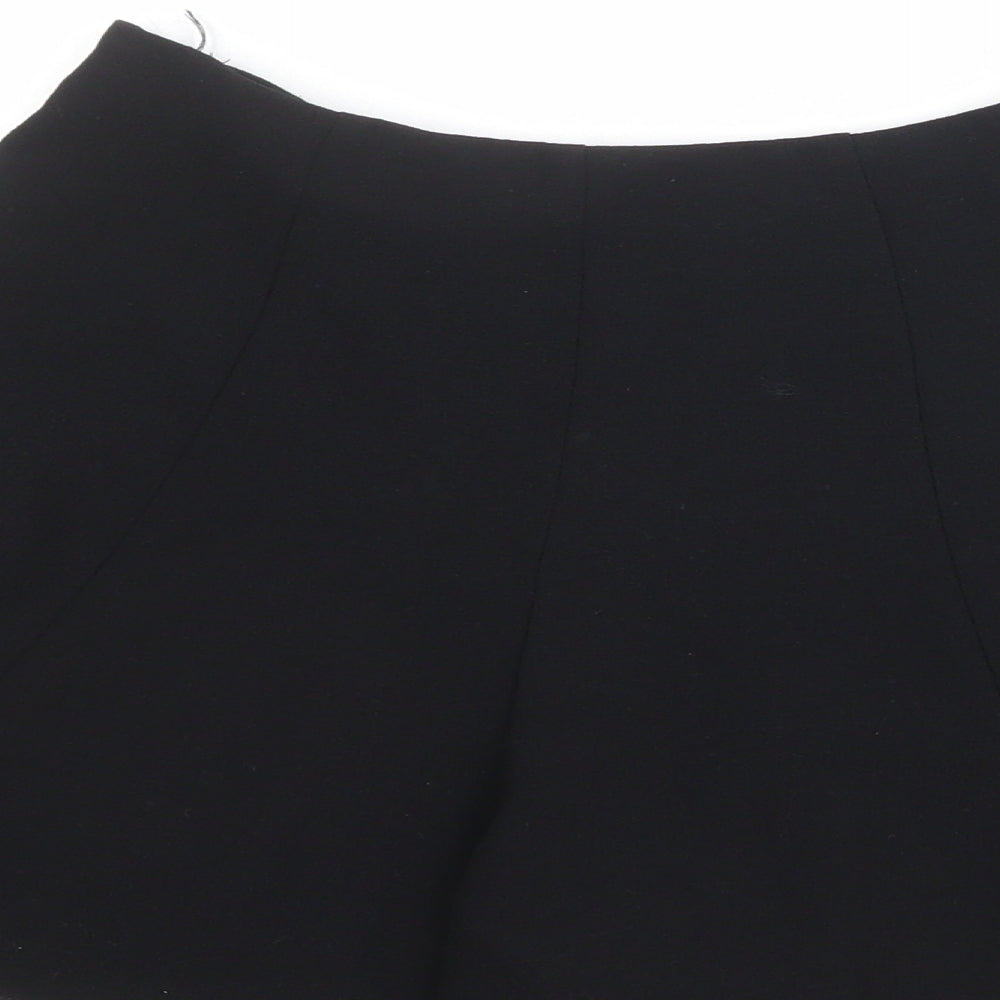 Brand and care label for Miss Selfridge women’s black polyester culotte shorts, size UK 8, regular zip