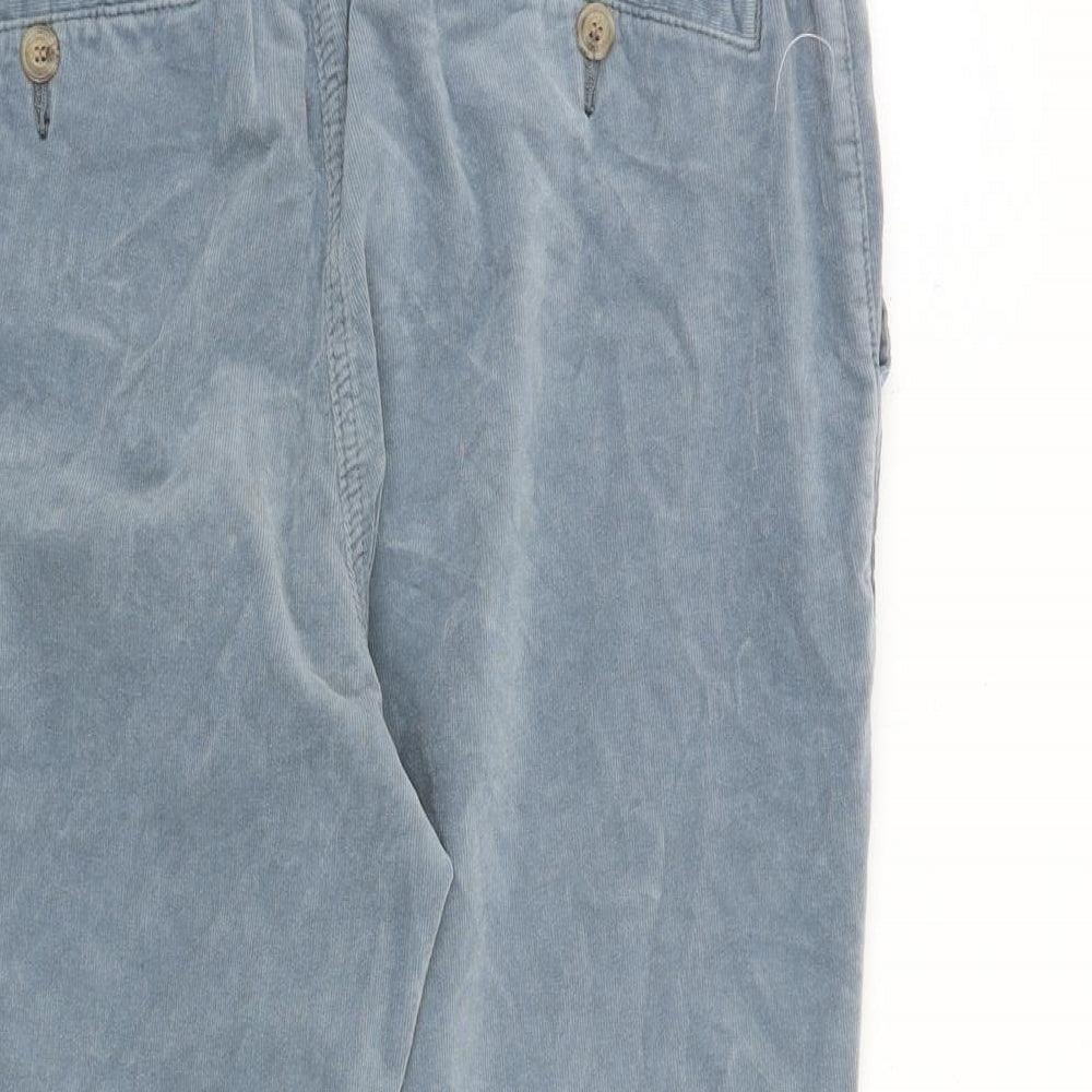 Brand and care label for EDC women’s blue cotton trousers, size UK 32, in regular zip