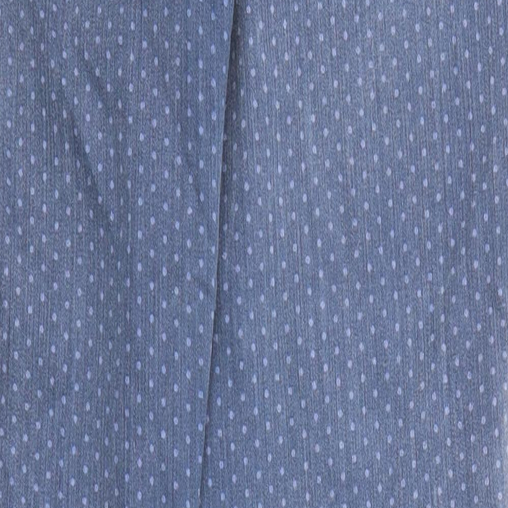 Brand and care label for ESPRIT women’s blue polka dot cotton skinny jeans, size UK 29, in regular zip - ankle zip