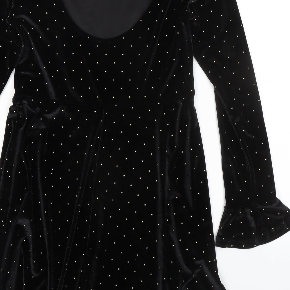Brand and care label for ASOS women’s black polka dot polyester a-line, size UK 8, round neck pullover