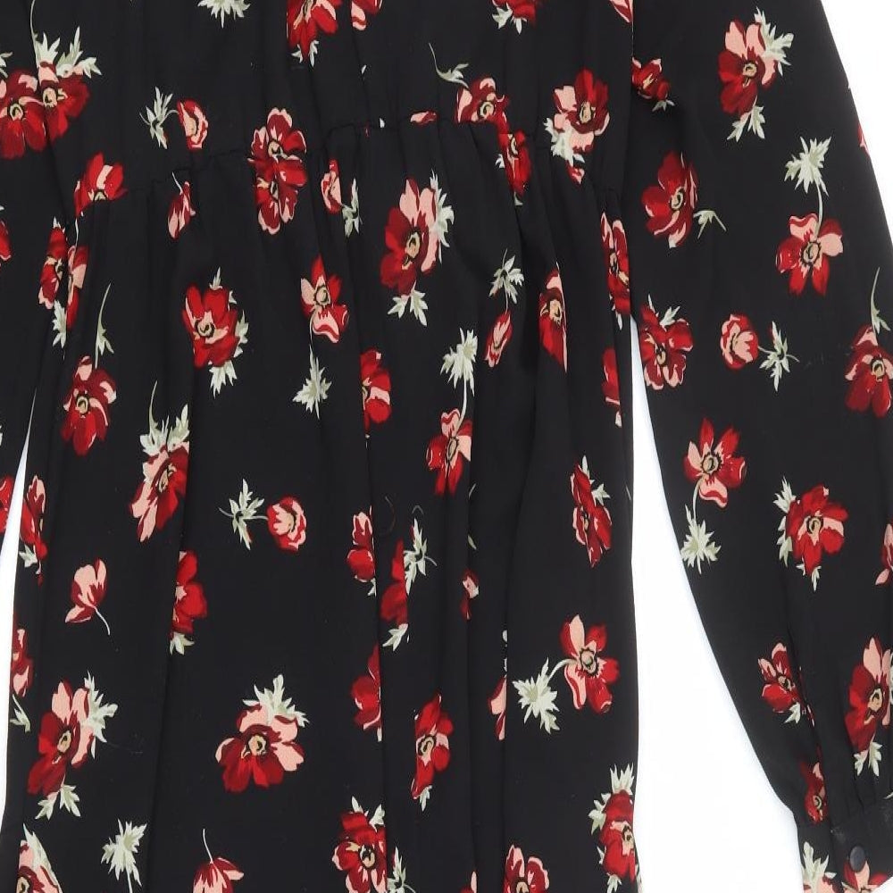 Brand and care label for Miss Selfridge women’s black floral polyester a-line, size UK 10, round neck button