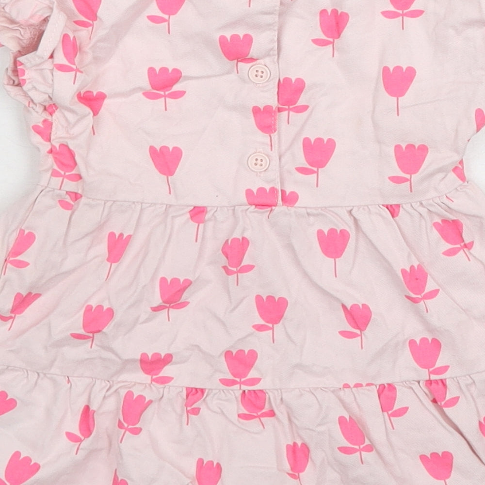Brand and care label for Marks & Spencer girls’ pink floral cotton a-line, size 3-6, months round neck button