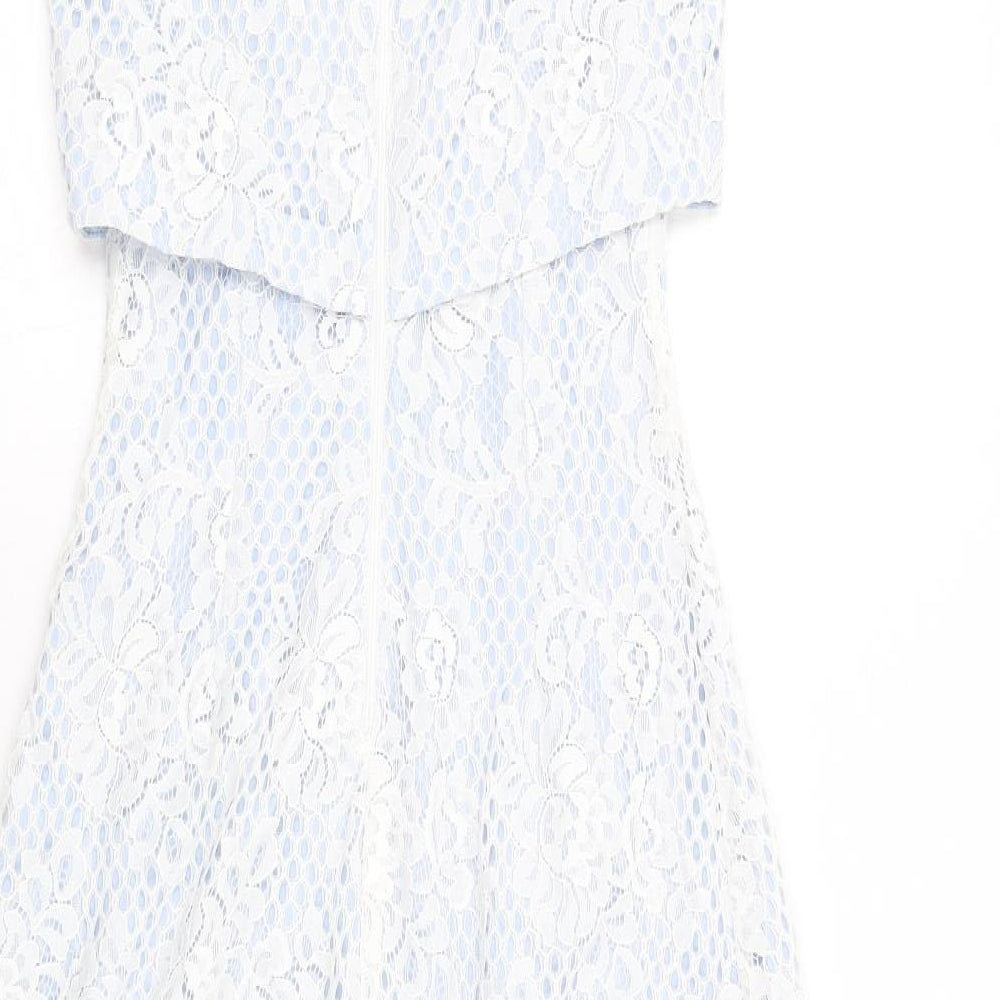 Brand and care label for Miss Selfridge women’s blue nylon a-line, size UK 6, round neck zip