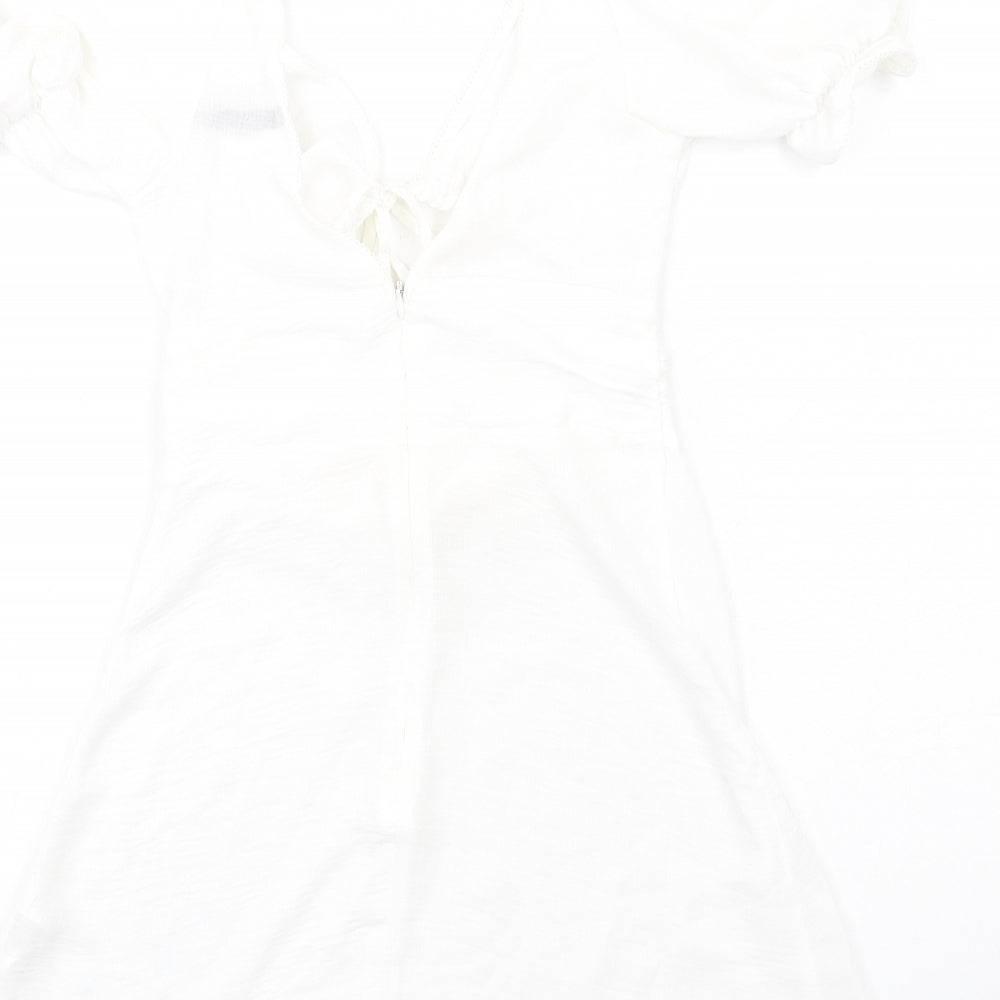 Brand and care label for ASOS women’s white polyester a-line, size UK 8, v-neck zip