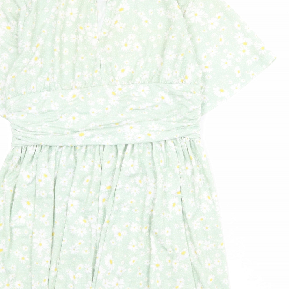 Brand and care label for ASOS women’s green floral polyester mini, size UK 14, round neck button