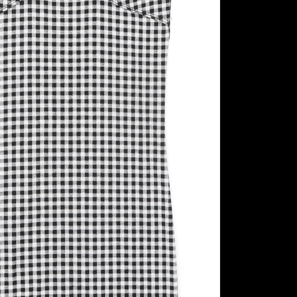 Brand and care label for Miss Selfridge women’s black check polyester shift, size UK 14, mock neck pullover