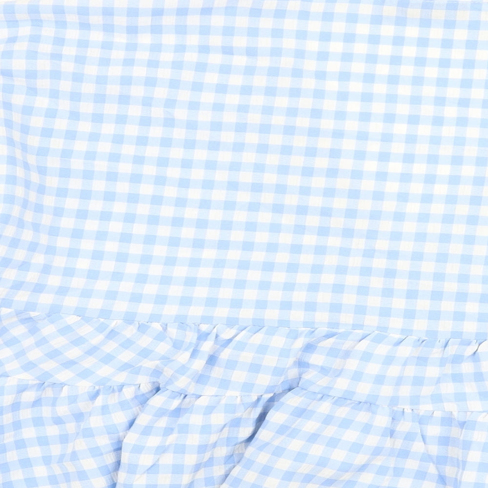 Brand and care label for ASOS women’s blue check polyester basic blouse, size UK 10, v-neck