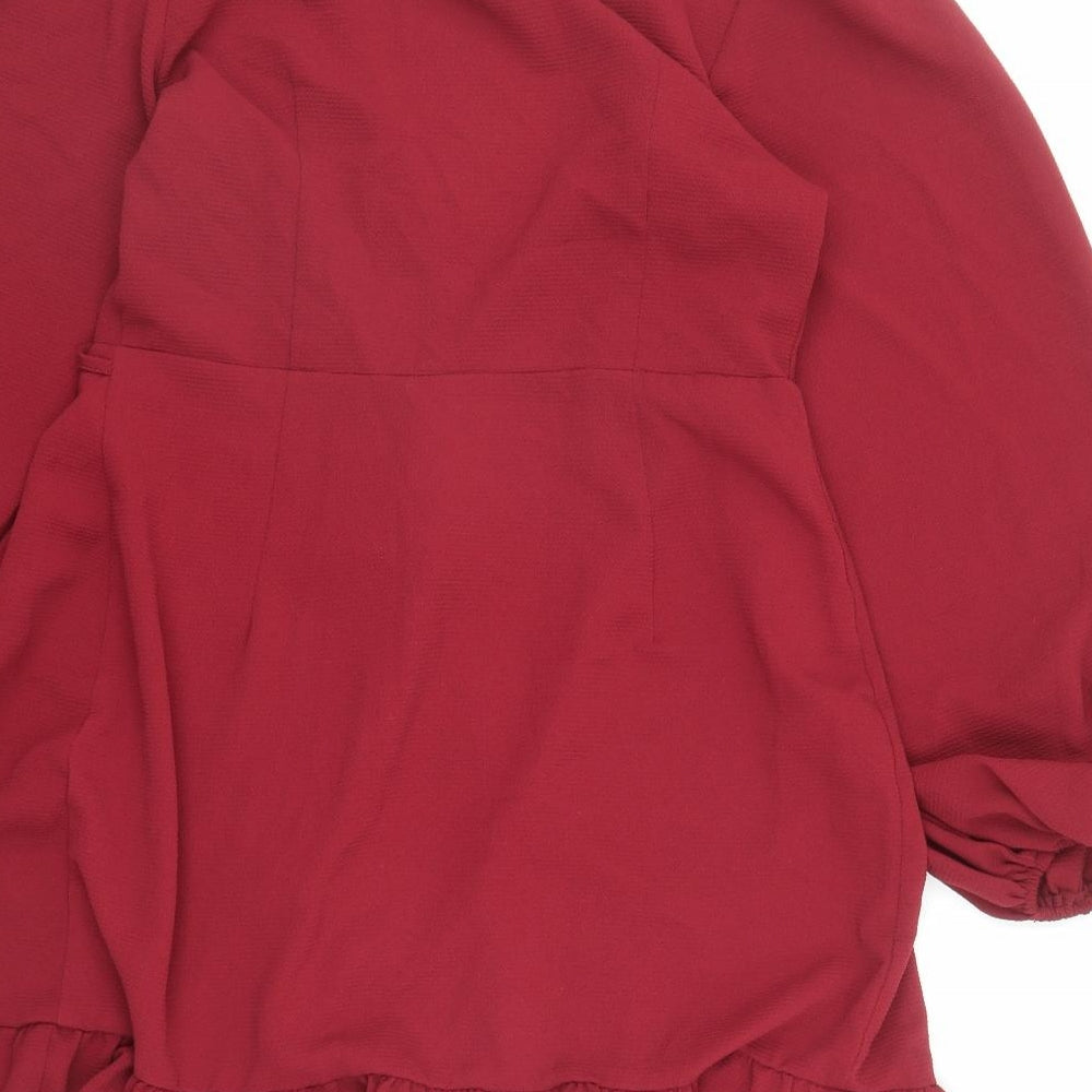 Brand and care label for ASOS women’s red polyester kimono blouse, size UK 12, collared